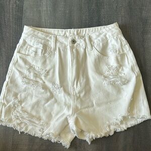 Ripped jean shorts. High-waisted.